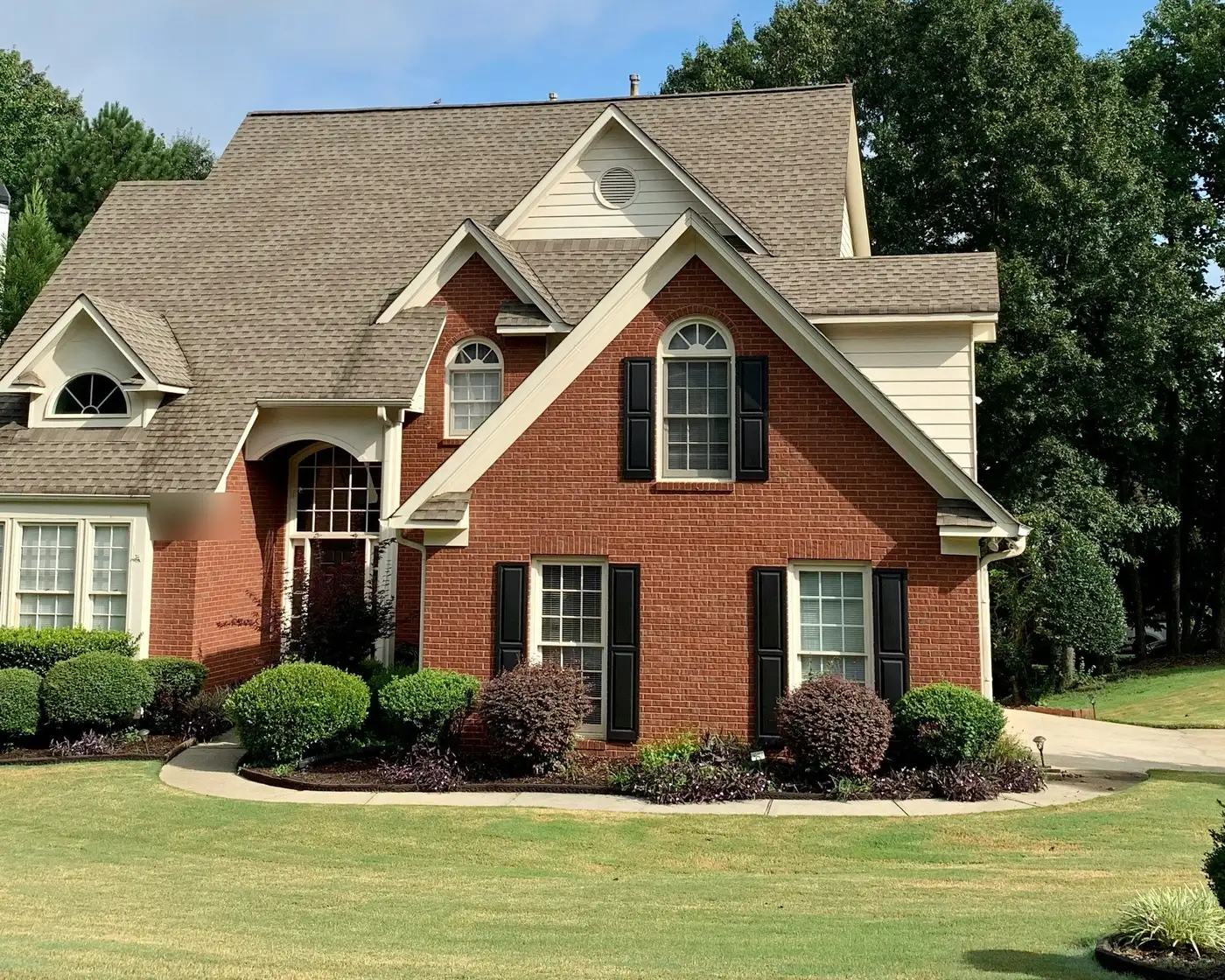 Exterior of a two-story brick single-family home — illustrative of the kind of rental property Kitespire is built for.
